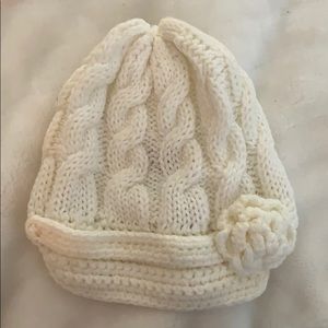 Soft knit winter hat with brim and flower detail